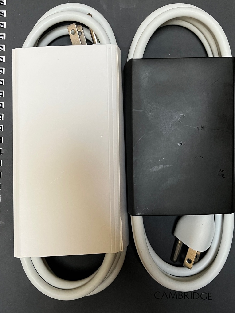 Apple White and Black Tablet Power Adapters with Coiled Cables